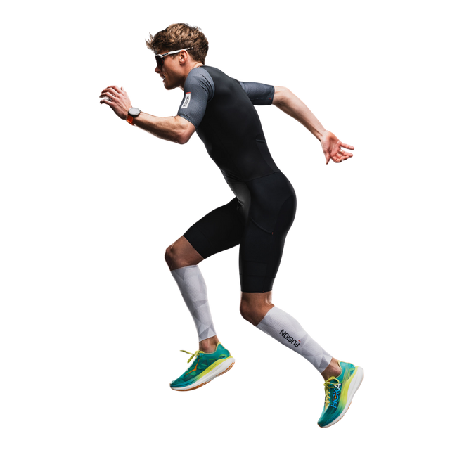FUSION Tempo! TWO Unisex Tri Suit in All Black shown flexing, demonstrating the suit's stretch and range of motion